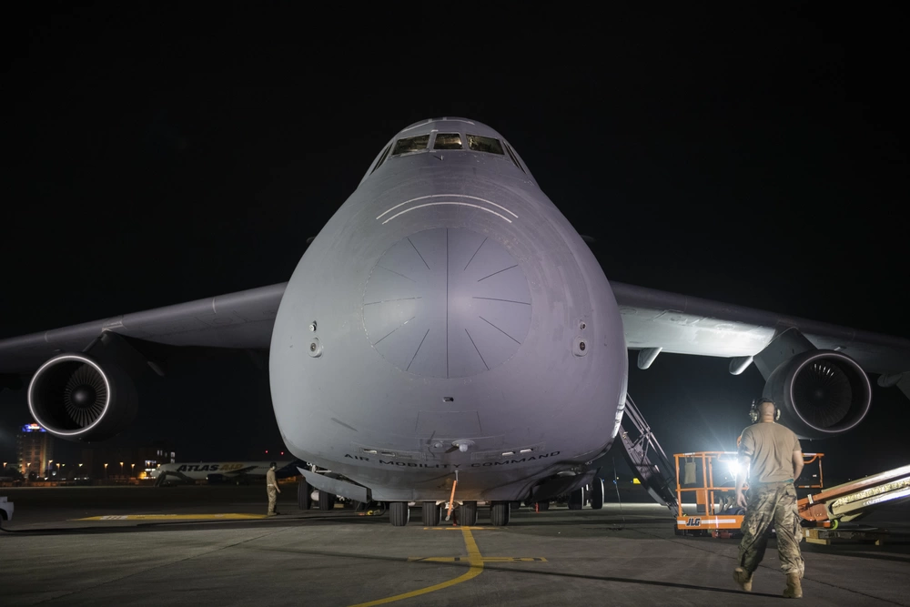 Tech. Sgt. Terence Young, 730th Air Mobility Squadron aircraft maintenance craftsman, walks towards a C-5M Super Galaxy at Yokota Air Base, Japan, Sept. 14, 2021. The training provided Airmen an opportunity to become familiarized with the maintenance procedures of a C-5. (U.S. Air Force photo by Senior Airman Brieana E. Bolfing)